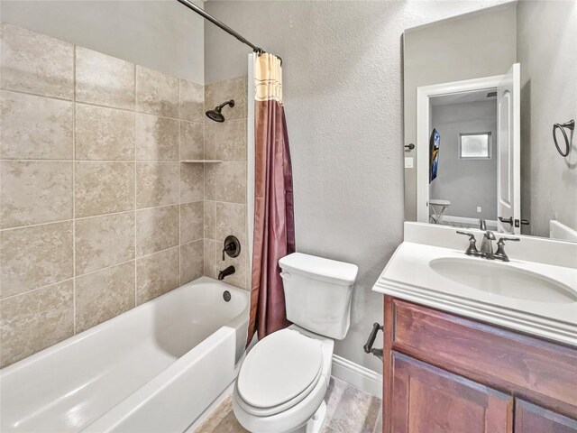 full bathroom featuring vanity, toilet, and shower / bath combo with shower curtain