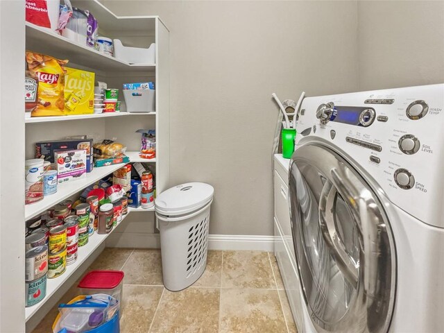 laundry room featuring washer / dryer