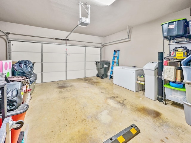 garage with a garage door opener and refrigerator