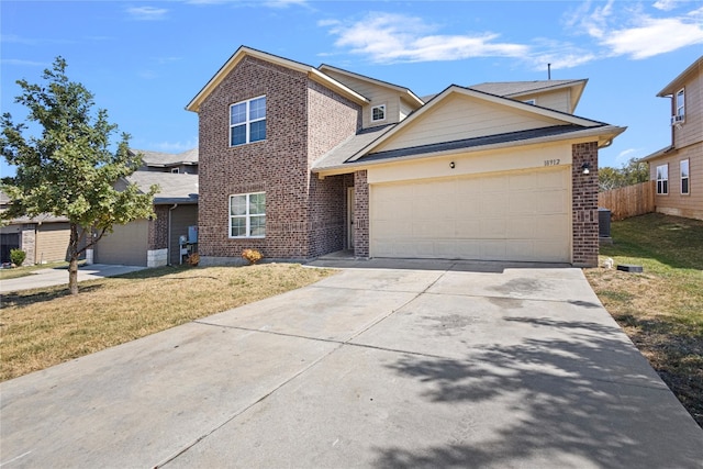 front of property with a garage and a front lawn