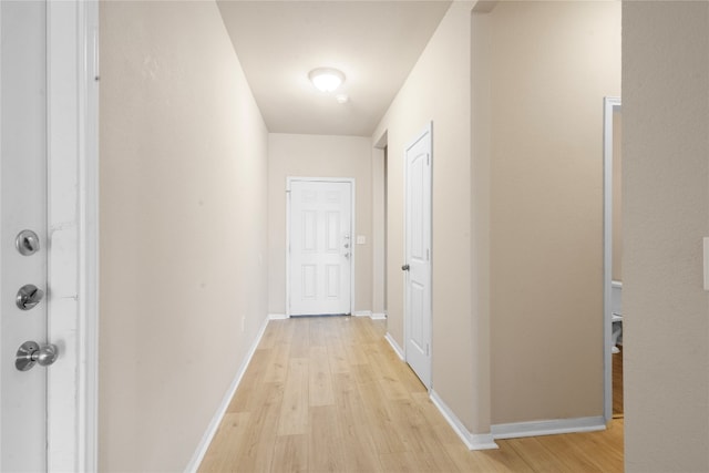 hallway with light wood-type flooring