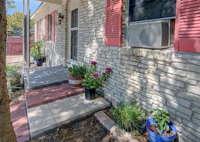 110 W Saint Johns Ave, Austin, TX 78752 - exterior space featuring cooling unit and stone siding
