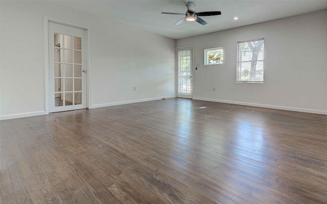 110 W Saint Johns Ave, Austin, TX 78752 - spare room with a ceiling fan, baseboards, and dark wood finished floors
