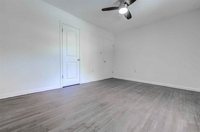 unfurnished room with ceiling fan and hardwood / wood-style floors