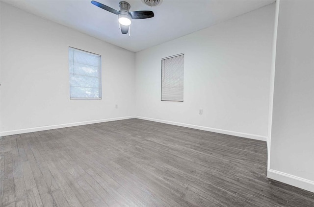 110 W Saint Johns Ave, Austin, TX 78752 - spare room with a ceiling fan, baseboards, visible vents, and dark wood-style floors