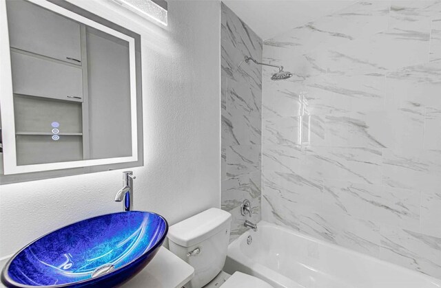 110 W Saint Johns Ave, Austin, TX 78752 - full bath with toilet, a textured wall, shower / bathing tub combination, and vanity