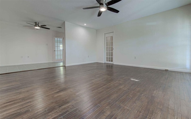 110 W Saint Johns Ave, Austin, TX 78752 - empty room with baseboards, a ceiling fan, and dark wood-style floors