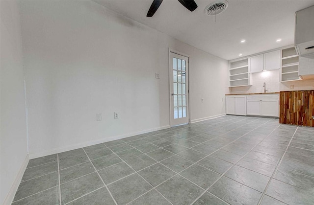 110 W Saint Johns Ave, Austin, TX 78752 - unfurnished living room featuring ceiling fan, tile patterned flooring, recessed lighting, baseboards, and visible vents