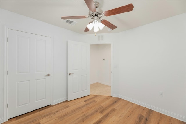 unfurnished bedroom with light hardwood / wood-style flooring and ceiling fan