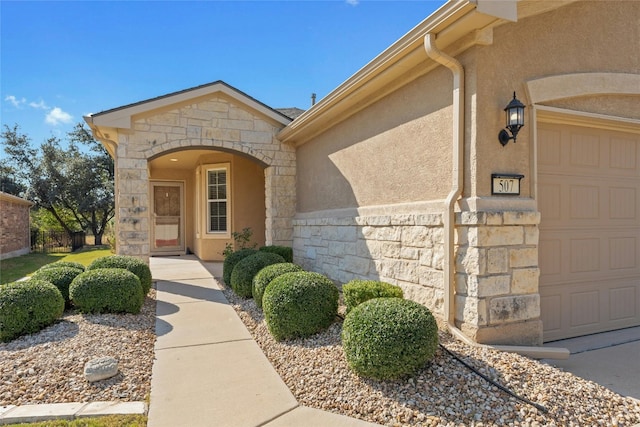 entrance to property featuring a garage