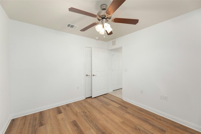 unfurnished room with light hardwood / wood-style flooring