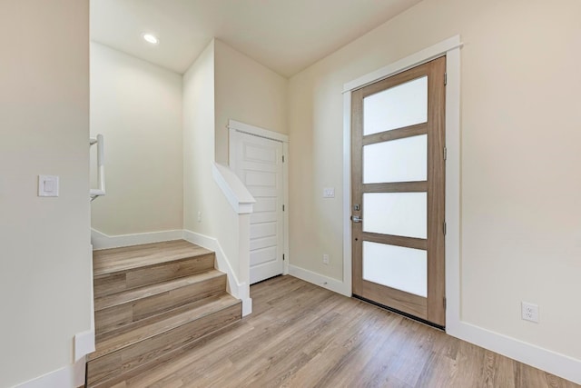 foyer with light hardwood / wood-style floors