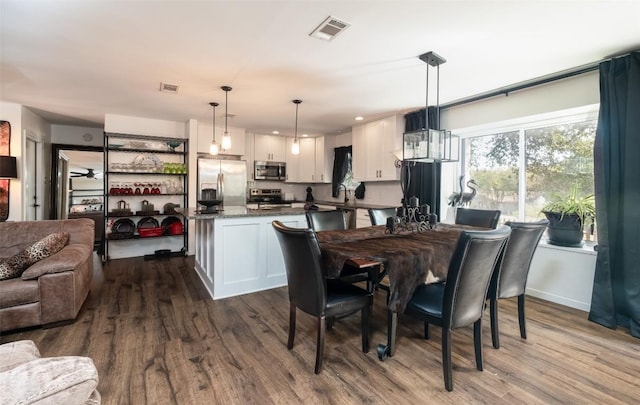 12614 Crystal Creek Dr, Buda, TX 78610 - dining area featuring dark wood-type flooring and recessed lighting