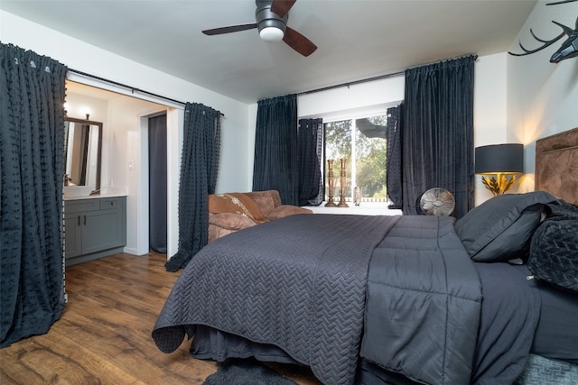 bedroom featuring ceiling fan, connected bathroom, and dark hardwood / wood-style floors