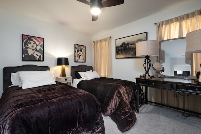 bedroom featuring ceiling fan and light carpet