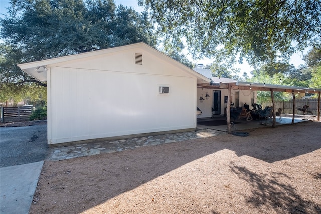 view of side of property featuring a patio