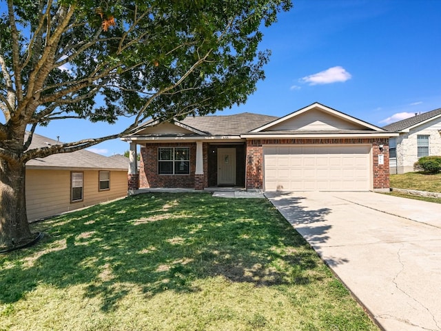 view of front of house featuring a garage and a front yard