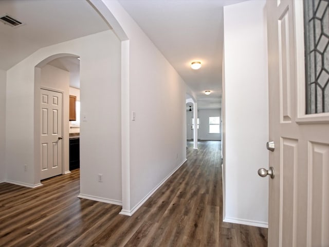 corridor featuring dark wood-type flooring