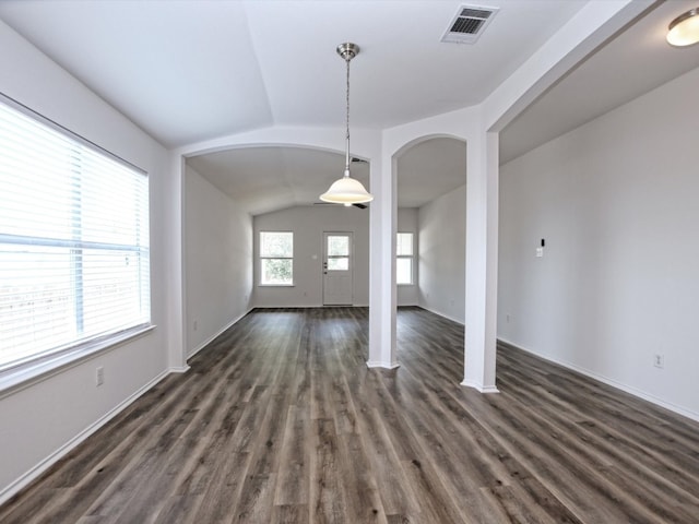 interior space with vaulted ceiling and dark hardwood / wood-style flooring