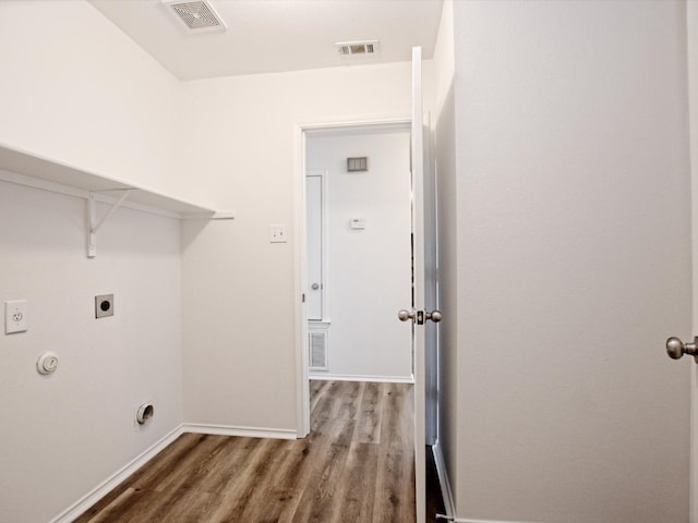 clothes washing area with hookup for an electric dryer and wood-type flooring