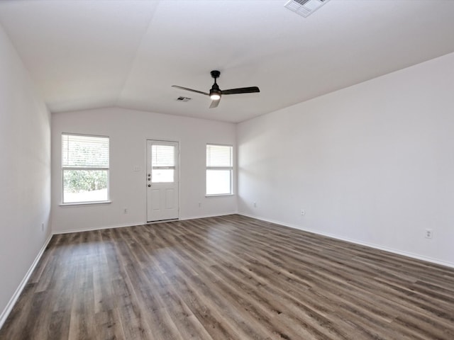 empty room with lofted ceiling, ceiling fan, and dark wood-type flooring