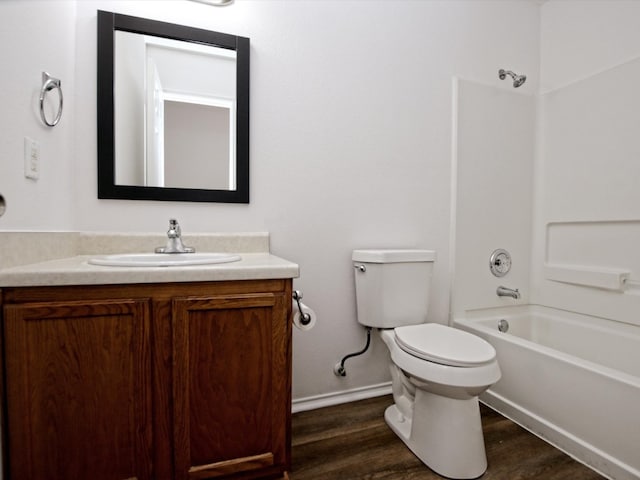 full bathroom featuring shower / bath combination, hardwood / wood-style floors, vanity, and toilet