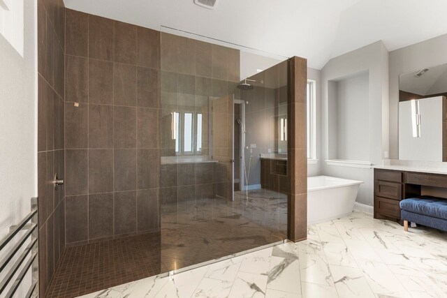 bathroom featuring vanity and plus walk in shower