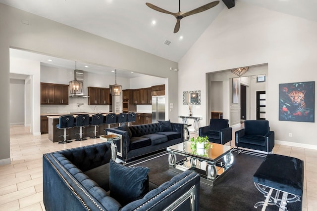 living room with high vaulted ceiling, beamed ceiling, and ceiling fan