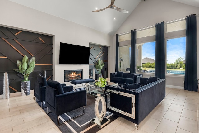 living room with high vaulted ceiling, ceiling fan, and light tile patterned floors