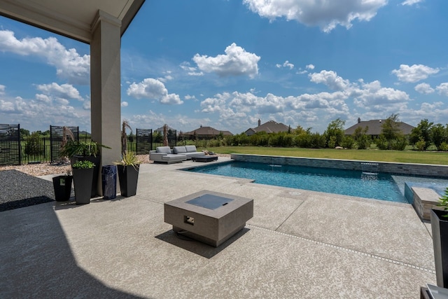 view of swimming pool with a lawn, a patio, and an outdoor living space