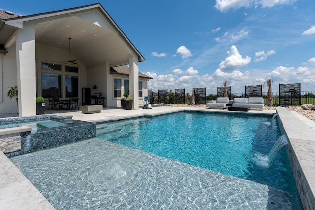 view of swimming pool with an in ground hot tub, ceiling fan, a patio, an outdoor hangout area, and pool water feature