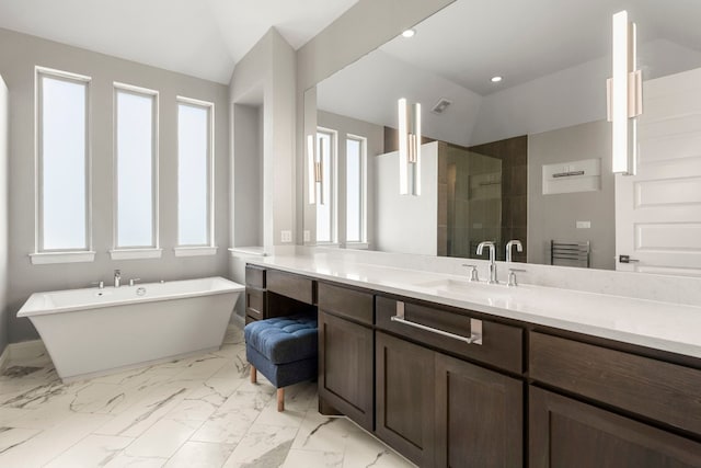 bathroom featuring plenty of natural light and lofted ceiling