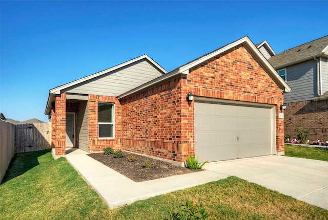 view of front of property with a garage and a front lawn