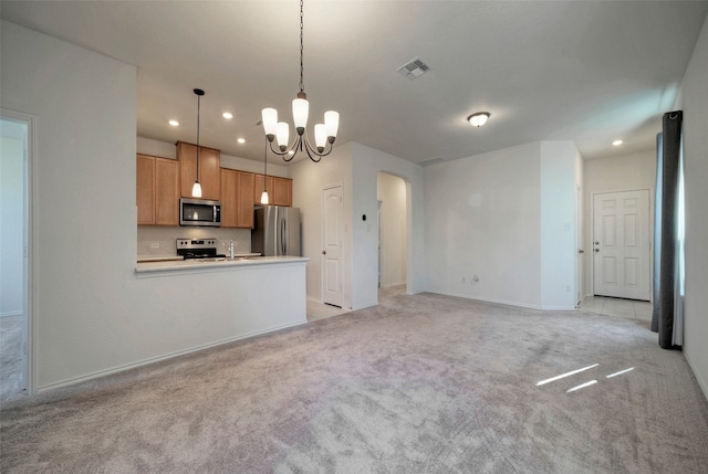 kitchen with sink, light carpet, a notable chandelier, pendant lighting, and stainless steel appliances