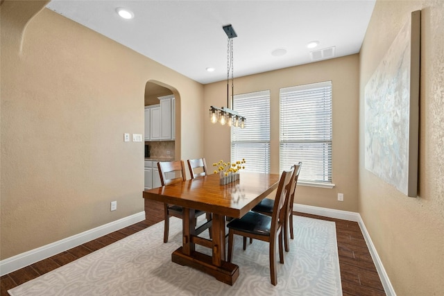 dining room with dark hardwood / wood-style flooring