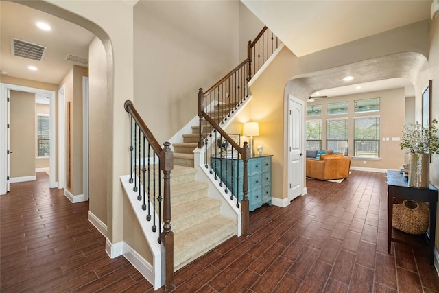 stairs featuring hardwood / wood-style flooring