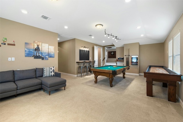 game room featuring indoor bar, rail lighting, pool table, light carpet, and vaulted ceiling