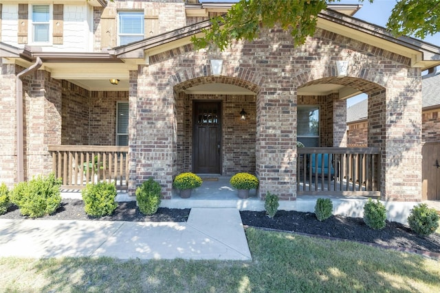 entrance to property with covered porch