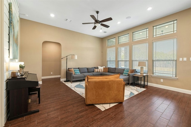 living room with hardwood / wood-style flooring and ceiling fan