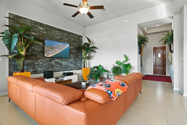 living room featuring ceiling fan and light tile patterned flooring