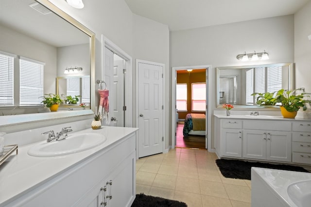 bathroom featuring tile patterned flooring and vanity