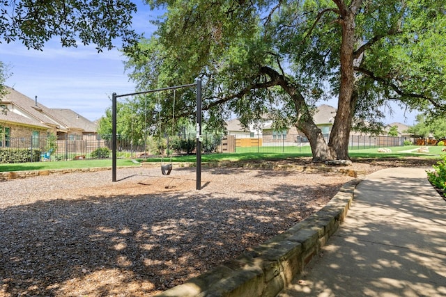 view of property's community with a playground