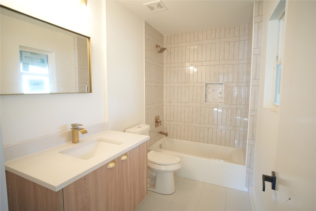 full bathroom with tile patterned floors, toilet, vanity, and tiled shower / bath