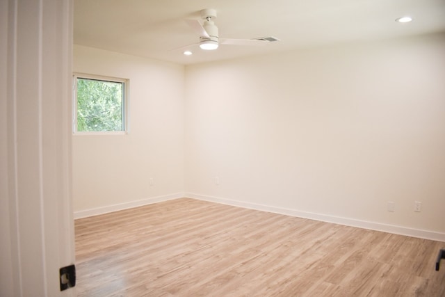 empty room with light hardwood / wood-style floors and ceiling fan