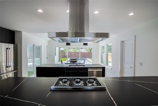 kitchen featuring appliances with stainless steel finishes, extractor fan, and sink