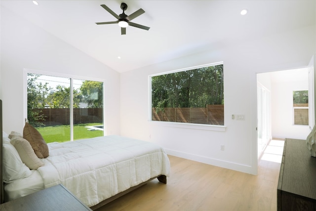 bedroom featuring light wood-type flooring, access to outside, vaulted ceiling, and ceiling fan