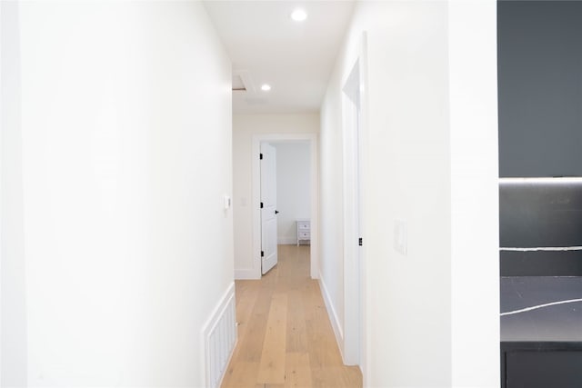 corridor with light wood-type flooring