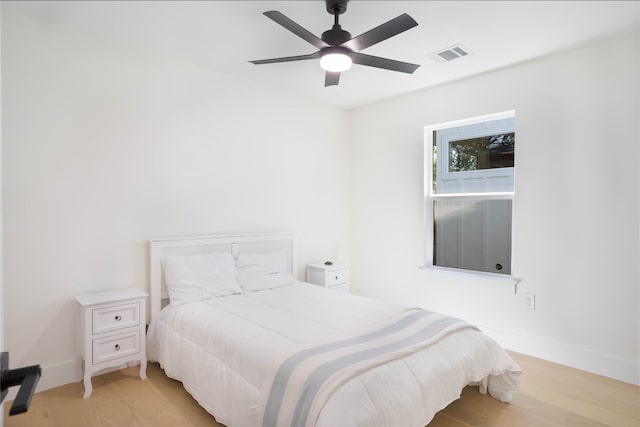 bedroom featuring ceiling fan and light hardwood / wood-style flooring