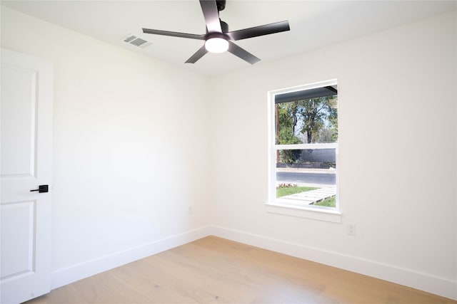 unfurnished room with light hardwood / wood-style flooring and ceiling fan