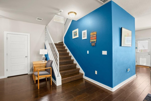 staircase featuring hardwood / wood-style flooring